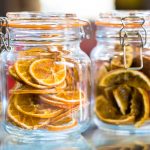 Dry orange slices in glass jar.